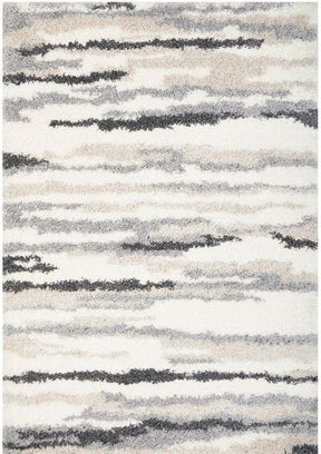 Ghazni slate shag area rug with deep 45mm pile in a moody modern living room