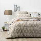 Stone medallion tufted cotton quilt cover with two pillowcases on a King bed