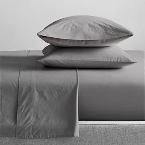 Sansepolcro GOTS organic cotton sheet combo packs on a bed