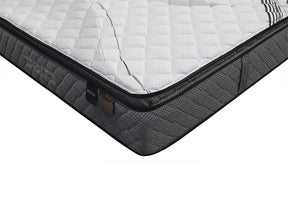 Castelrotto super firm mattress with knitted cover on a bed base