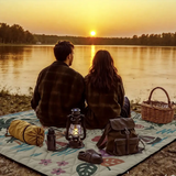 Rydal floral print picnic mat 198 x 198cm laid on grass with soft padded Oxford top and portable rope carry