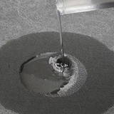 Light grey bath mat in use beside a shower, keeping the floor dry