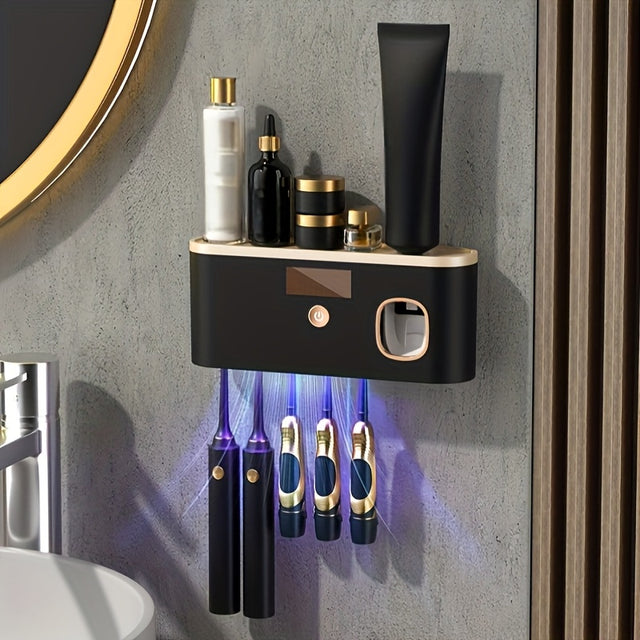 Olbia wall mounted toothbrush organiser in black and gold with toothpaste dispenser