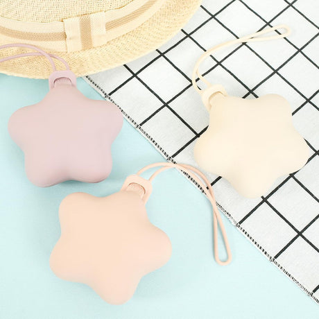 Star shaped silicone pacifier storage cases in blue, grey and green