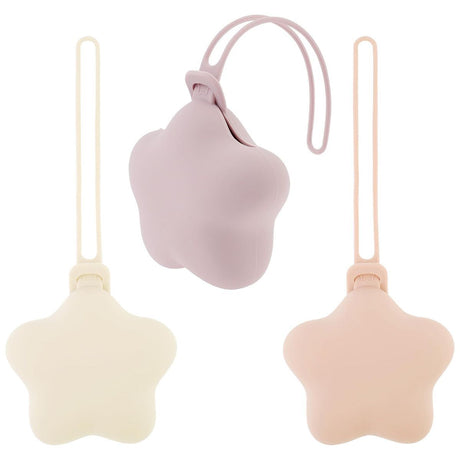 Star shaped silicone pacifier storage cases in purple, beige and pink