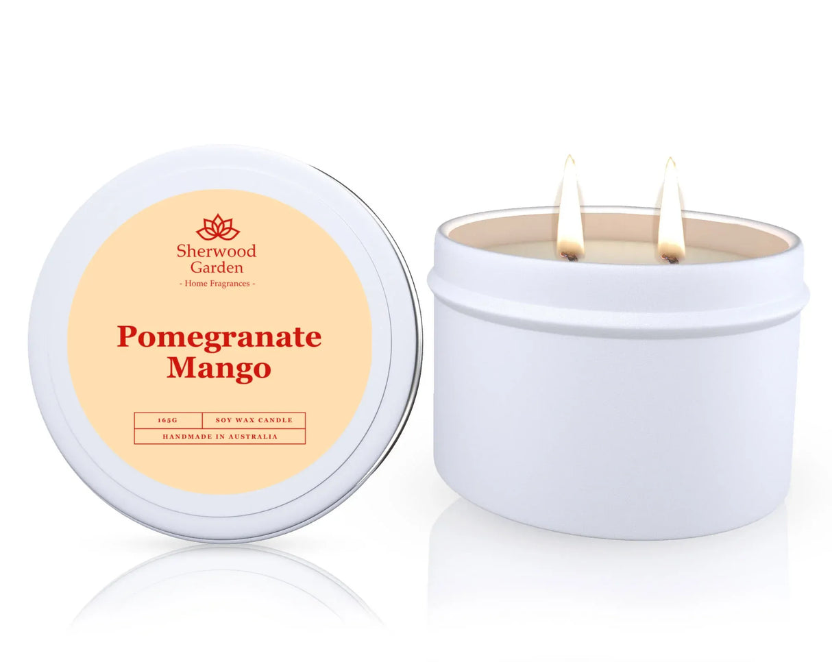 Pomegranate Mango soy candle in a tin