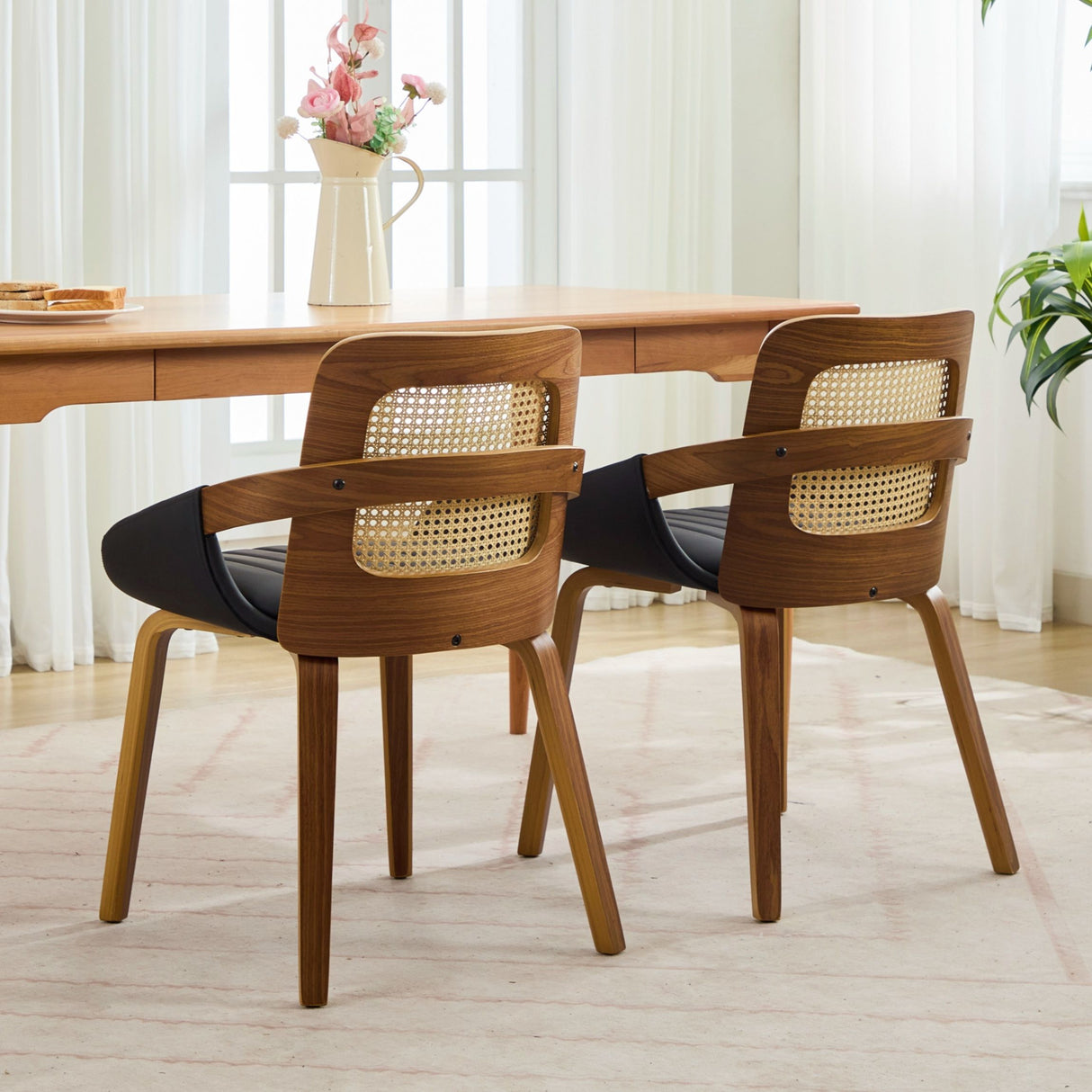 Greenock black rattan back dining chair in a modern dining room
