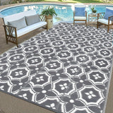 Reversible geometric braided outdoor patio mat