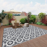 Reversible geometric braided outdoor patio mat