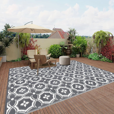 Reversible geometric braided outdoor patio mat