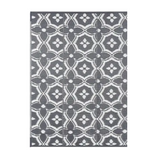 Reversible geometric braided outdoor patio mat