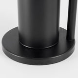Black toilet roll rack in a bathroom setting with rolls stacked vertically
