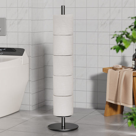 Black iron toilet roll stand holding several spare rolls beside a toilet