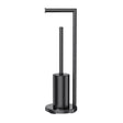 Black freestanding 2 in 1 toilet roll holder and toilet brush stand beside a toilet