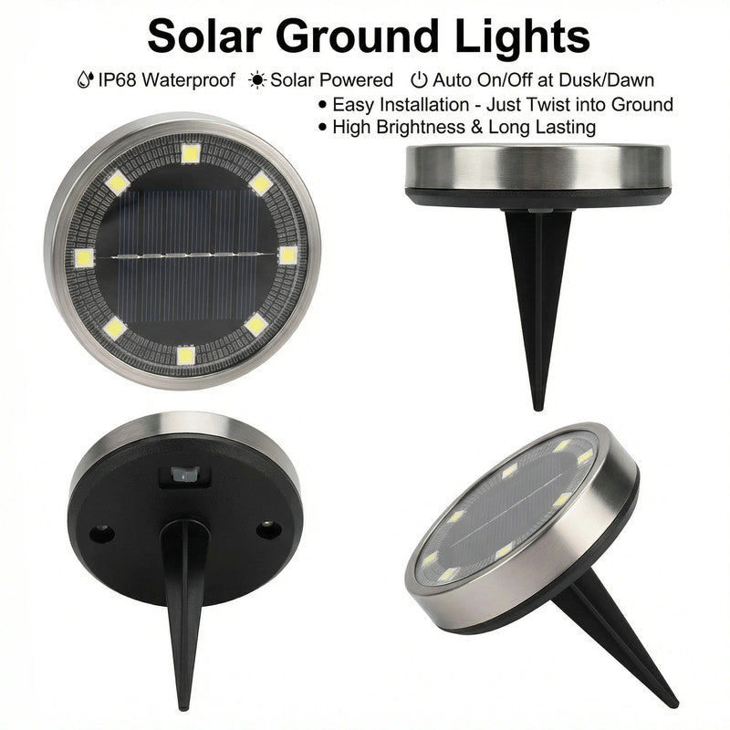 Warm white solar ground lights lining a garden pathway at night