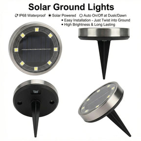 Warm white solar ground lights lining a garden pathway at night