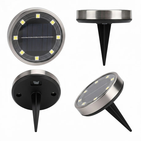 Solar garden spike light with warm white LEDs in a lawn