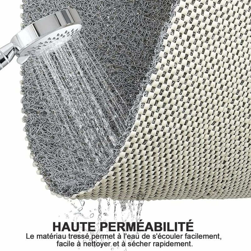 Close up of the looped loofah textured surface and open drainage holes on the PVC shower mat