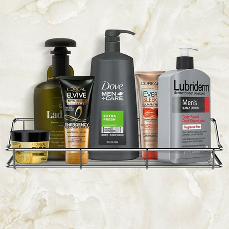 Adhesive stainless steel shower shelf mounted on tile holding shampoo bottles