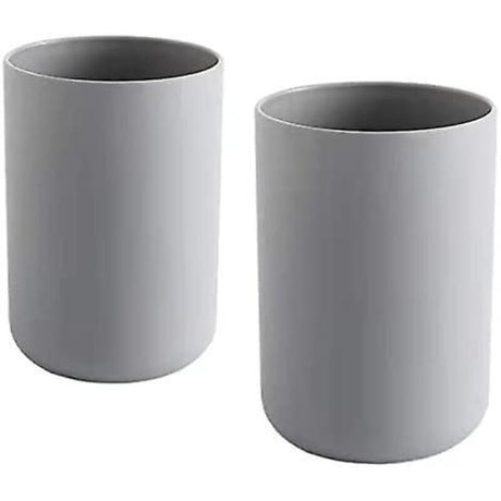Grey 300 mL plastic toothbrush cup holding toothbrushes and a tube of toothpaste
