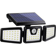 Three head solar spotlight with motion sensor lighting a garden facade