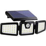 Three head solar spotlight with motion sensor lighting a garden facade
