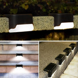 Solar stair light glowing warm white at night