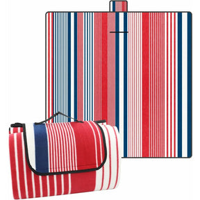 Coniston striped microfleece picnic blanket 200 x 200cm laid on grass with red blue and white stripe top and water resistant backing