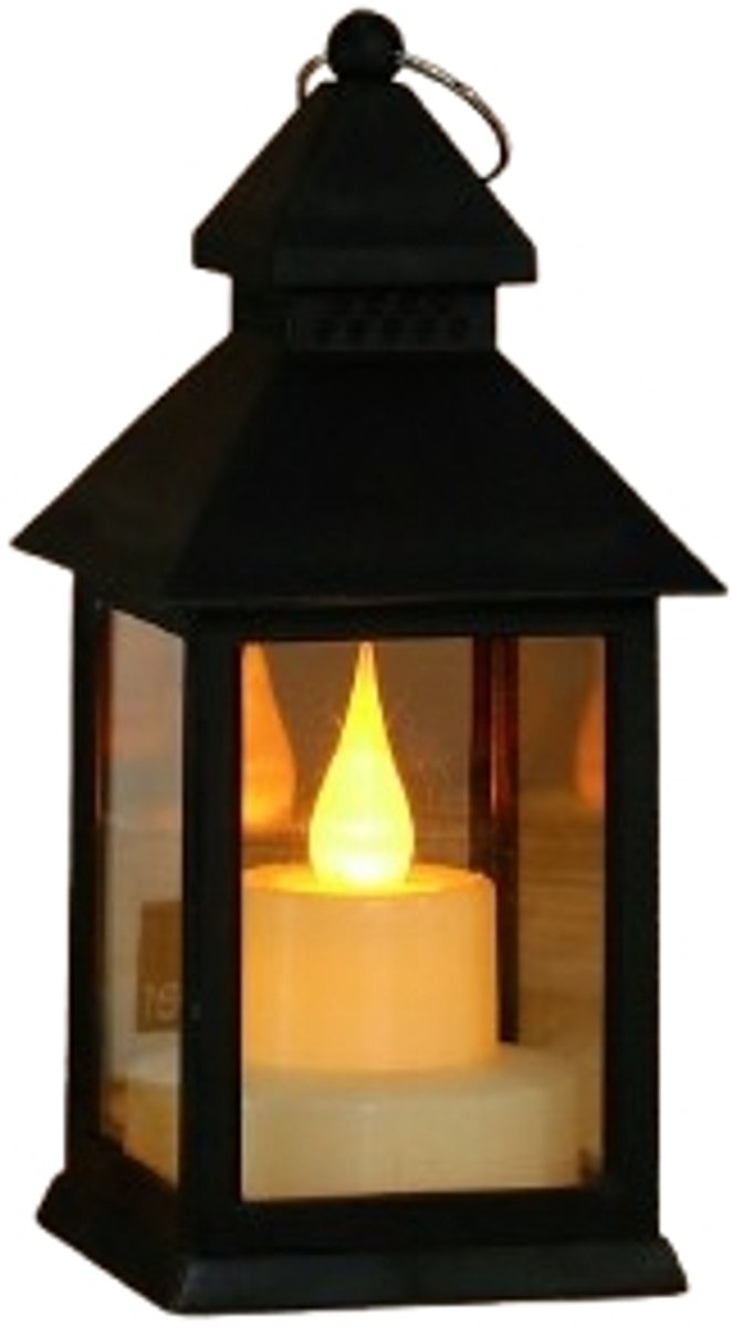 Two black metal LED lanterns with flickering candlelight on a garden table