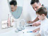 White organiser installed above a bathroom basin holding brushes and towels