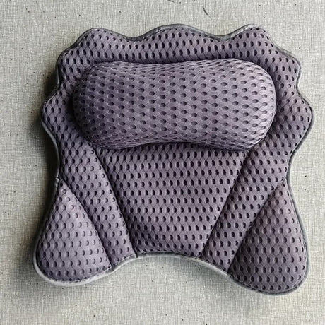 Bath pillow in a styled bathroom setting for an at home spa soak