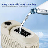 Removable 0.5 litre water tank of white portable ice maker being filled
