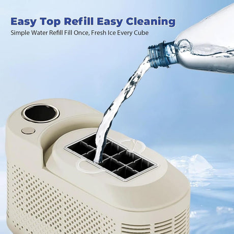 Removable 0.5 litre water tank of white portable ice maker being filled