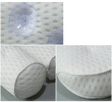 Machine washable white bath pillow shown flat after cleaning