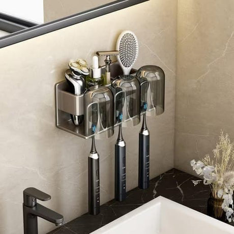Close up of the three brush slots on the light grey aluminium toothbrush holder