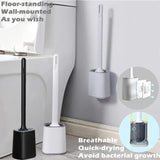 White toilet brush lifted from its ventilated holder showing the shallow drip tray
