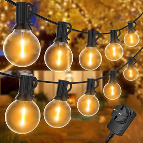 Warm white G40 globe string lights strung across an outdoor patio