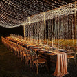Warm white LED curtain fairy lights cascading down a wall backdrop