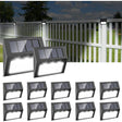 Cool white solar stair lights mounted along garden steps at dusk