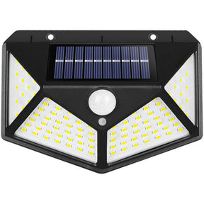 Four sided 100 LED solar motion sensor light mounted on a garden wall