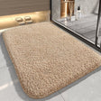 Dark beige plush microfibre bath mat, 40 x 60 cm, on a bathroom floor