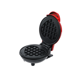 Red mini electric waffle maker with heart shaped plate, closed
