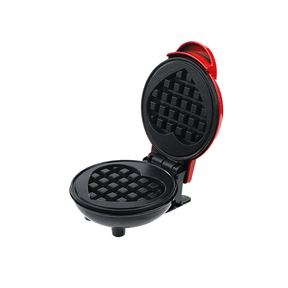 Red mini electric waffle maker with heart shaped plate, closed