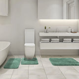 Underside of the sage green bath mat showing the non slip rubber backing