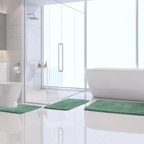 Small sage green microfibre bath mat, 41 x 61 cm, beside a vanity