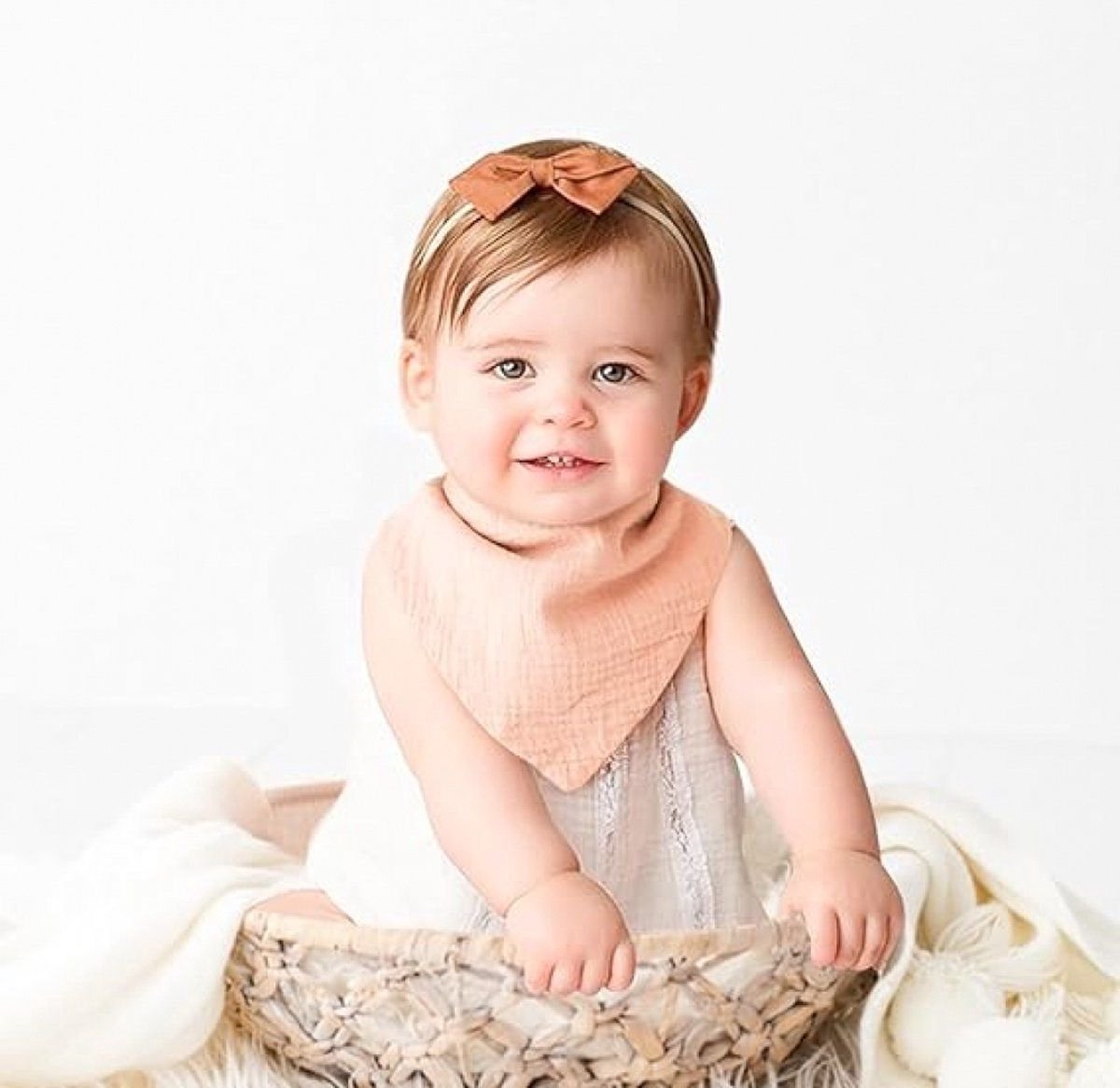Set of ten soft cotton baby bibs in assorted colours