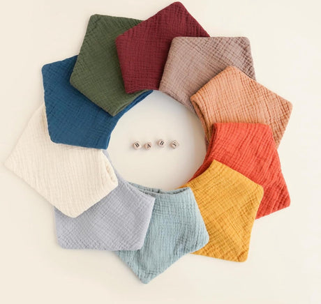 Set of ten soft cotton baby bibs in assorted colours