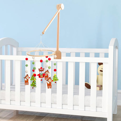 Wooden mobile holder attached to a cot