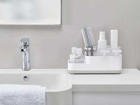 Removable drip tray sliding out from the base of the white organiser