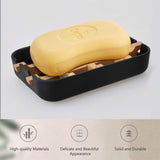 Removable catch tray sliding out from under the bamboo soap dish